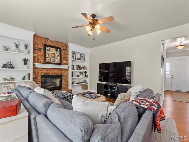 1509 Cedar Ridge Dr, Ofallon, IL 62269 - living area with wood finished floors, a ceiling fan, and built in shelves