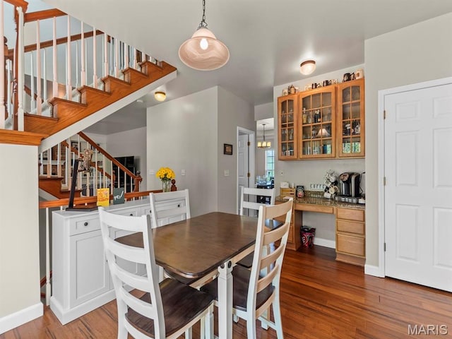 1509 Cedar Ridge Dr, Ofallon, IL 62269 - dining room with wood finished floors, stairway, baseboards, and built in desk