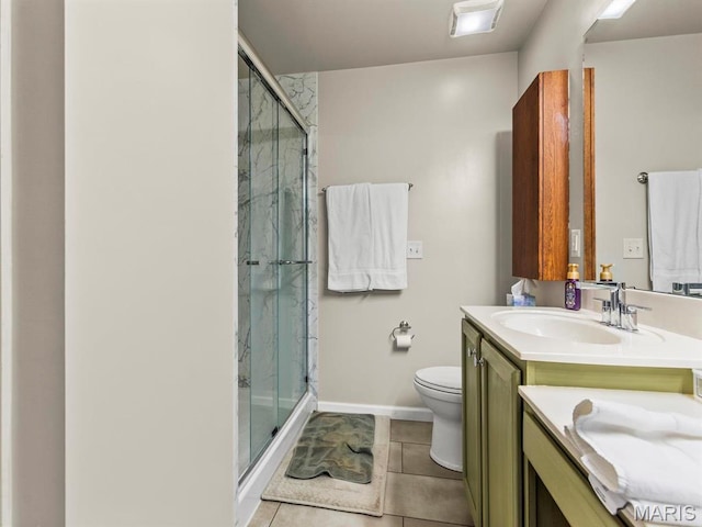 1509 Cedar Ridge Dr, Ofallon, IL 62269 - full bathroom featuring a stall shower, tile patterned floors, toilet, vanity, and baseboards