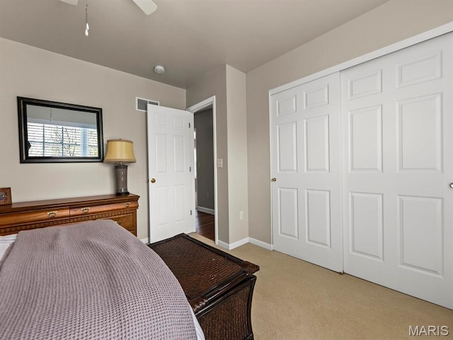 1509 Cedar Ridge Dr, Ofallon, IL 62269 - bedroom with light carpet, a closet, baseboards, and ceiling fan