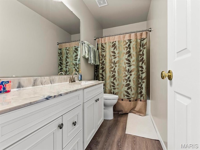 1509 Cedar Ridge Dr, Ofallon, IL 62269 - bathroom with toilet, wood finished floors, vanity, and curtained shower