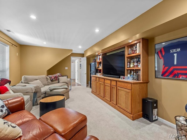 1509 Cedar Ridge Dr, Ofallon, IL 62269 - living room featuring recessed lighting, light carpet, a bar, and baseboards