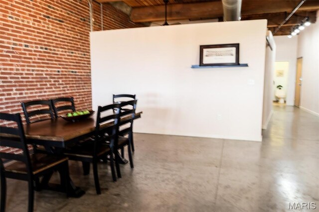 1015 Washington Ave Unit 507, Saint Louis, MO 63101 - dining room with a high ceiling and finished concrete flooring