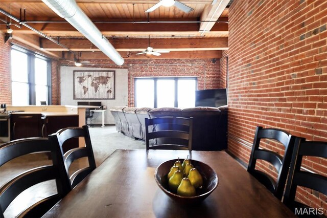 1015 Washington Ave Unit 507, Saint Louis, MO 63101 - dining area with brick wall, a ceiling fan, healthy amount of natural light, beam ceiling, and wooden ceiling