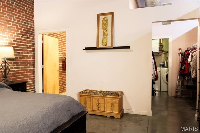 1015 Washington Ave Unit 507, Saint Louis, MO 63101 - bedroom with washer / clothes dryer, concrete floors, and baseboards