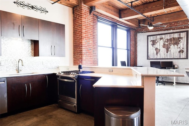 1015 Washington Ave Unit 507, Saint Louis, MO 63101 - kitchen with appliances with stainless steel finishes, a sink, wooden ceiling, a peninsula, and finished concrete floors