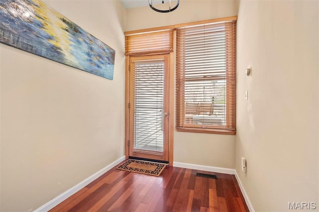 2209 Park Ave, Saint Louis, MO 63104 - doorway to outside with wood finished floors and baseboards