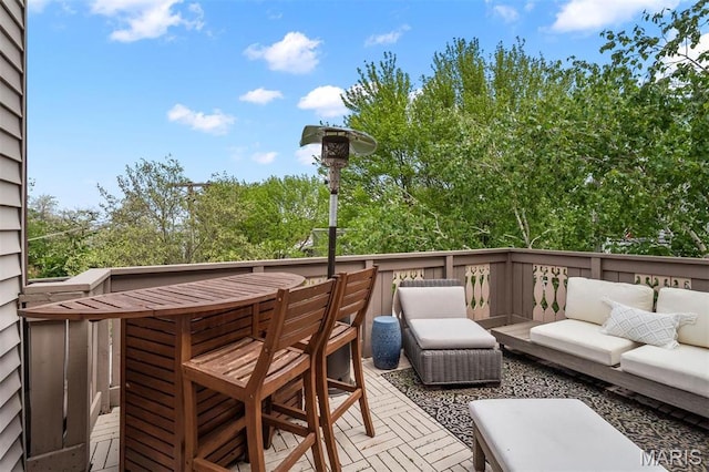 2209 Park Ave, Saint Louis, MO 63104 - wooden deck featuring outdoor lounge area and view of wooded area