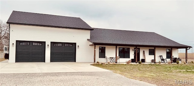 17900 Fletcher Ln, New London, MO 63459 - view of front facade with a porch, driveway, a front yard, and a shingled roof