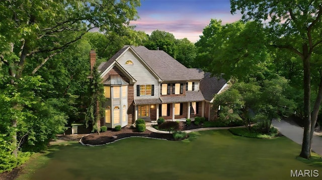1508 Pacland Ridge Ct, Chesterfield, MO 63005 - view of front of home with a chimney and a front lawn