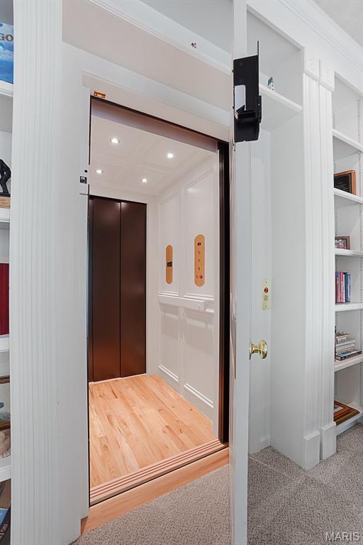 1508 Pacland Ridge Ct, Chesterfield, MO 63005 - elevator featuring carpet flooring, recessed lighting, and crown molding