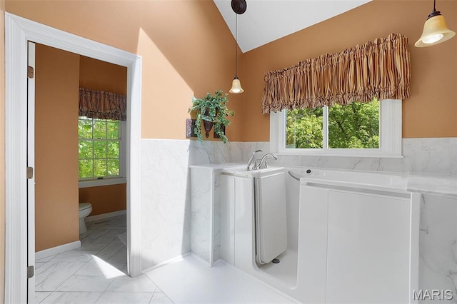1508 Pacland Ridge Ct, Chesterfield, MO 63005 - laundry room with washing machine and dryer and light marble finish floors