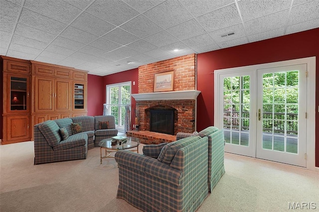1508 Pacland Ridge Ct, Chesterfield, MO 63005 - living area featuring carpet, a brick fireplace, and a paneled ceiling