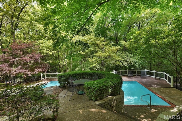 1508 Pacland Ridge Ct, Chesterfield, MO 63005 - view of swimming pool featuring a patio and a forest view