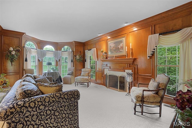 1508 Pacland Ridge Ct, Chesterfield, MO 63005 - living area with a fireplace with flush hearth, carpet, wooden walls, and crown molding
