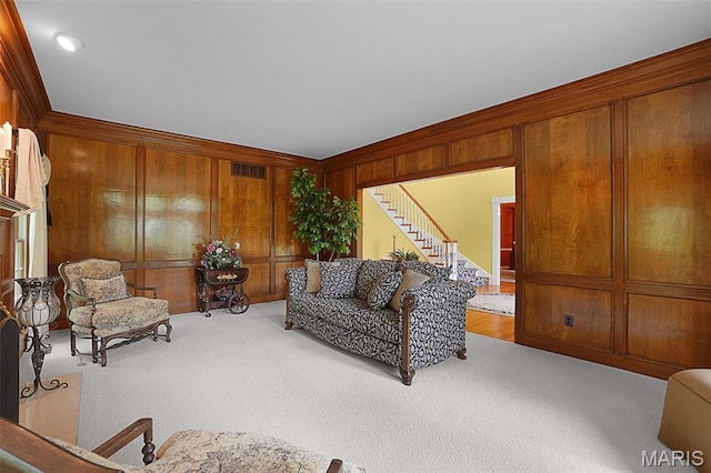 1508 Pacland Ridge Ct, Chesterfield, MO 63005 - carpeted living area featuring ornamental molding, stairway, and wood walls