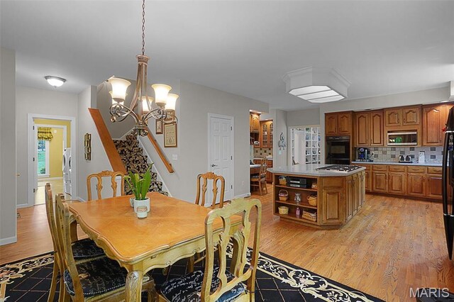1508 Pacland Ridge Ct, Chesterfield, MO 63005 - dining area featuring light wood-style flooring and a chandelier