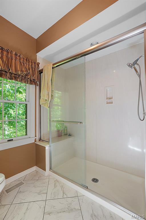 1508 Pacland Ridge Ct, Chesterfield, MO 63005 - full bath with marble look tiles and a shower stall