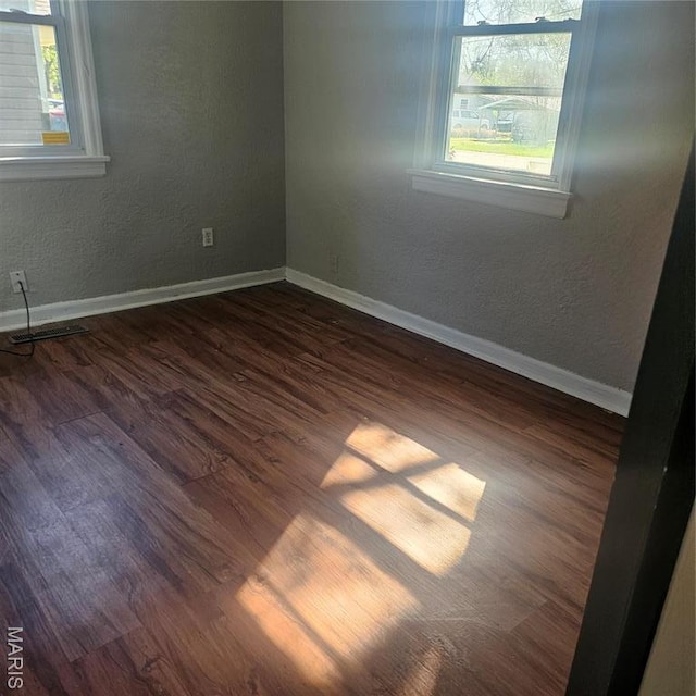 600 Plum, Cahokia, IL 62206 - empty room featuring dark wood finished floors and baseboards