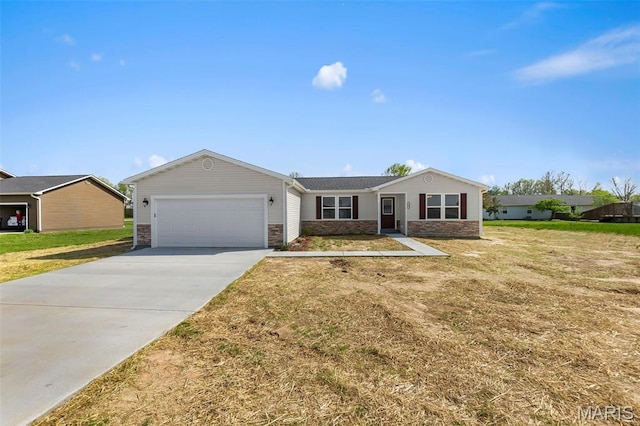 112 Tupelo St, Advance, MO 63730 - single story home with an attached garage, concrete driveway, a front lawn, and stone siding