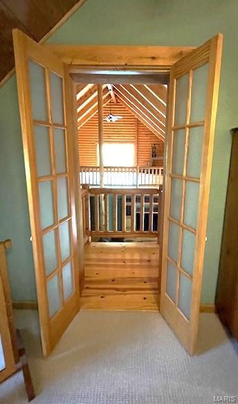 577 Schluersburg Rd, Augusta, MO 63332 - wine area with french doors, lofted ceiling, and carpet floors