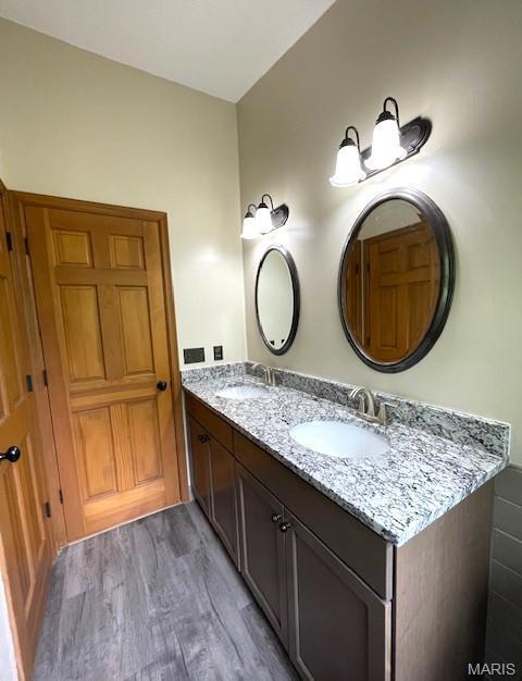 577 Schluersburg Rd, Augusta, MO 63332 - bathroom with double vanity and wood finished floors