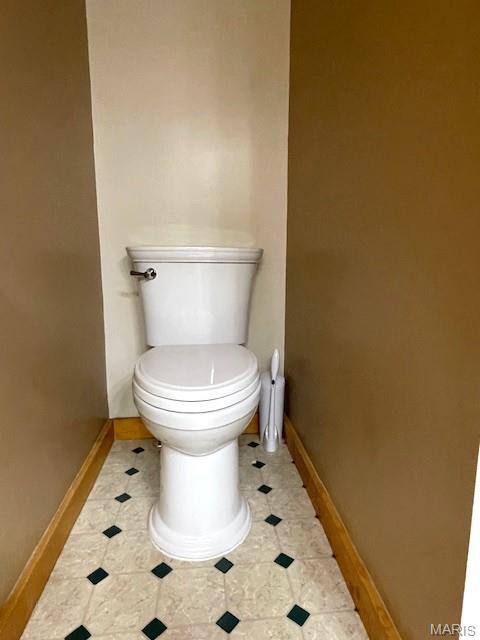 577 Schluersburg Rd, Augusta, MO 63332 - bathroom featuring baseboards, toilet, and tile patterned floors