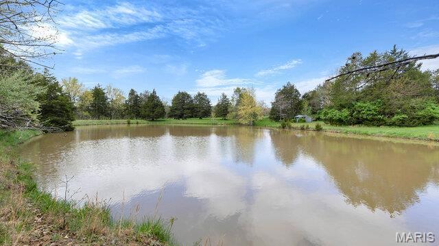 28470 Sunnyside Rd, Warrenton, MO 63383 - water view featuring a heavily wooded area