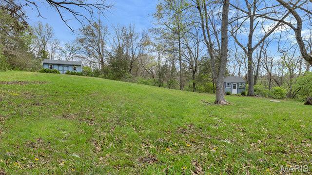 28470 Sunnyside Rd, Warrenton, MO 63383 - view of grassy yard featuring an outdoor structure