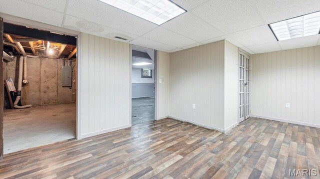 28470 Sunnyside Rd, Warrenton, MO 63383 - basement with electric panel, wood finished floors, a paneled ceiling, and baseboards