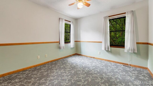 28470 Sunnyside Rd, Warrenton, MO 63383 - unfurnished room featuring a ceiling fan, a textured ceiling, carpet, and baseboards