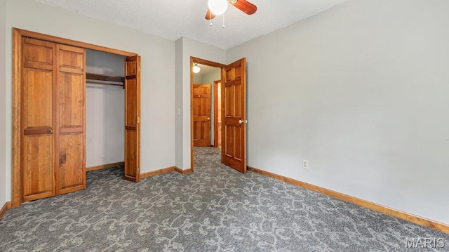 28470 Sunnyside Rd, Warrenton, MO 63383 - unfurnished bedroom with dark carpet, baseboards, a closet, and ceiling fan