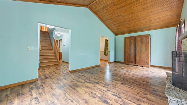 28470 Sunnyside Rd, Warrenton, MO 63383 - unfurnished living room featuring wooden ceiling, baseboards, stairs, wood finished floors, and high vaulted ceiling