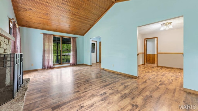 28470 Sunnyside Rd, Warrenton, MO 63383 - unfurnished living room with a stone fireplace, wood finished floors, high vaulted ceiling, baseboards, and wood ceiling