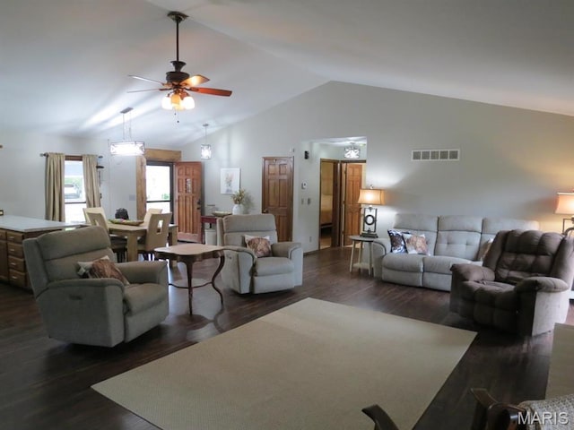 living area with a ceiling fan, dark wood-style floors, and high vaulted ceiling
