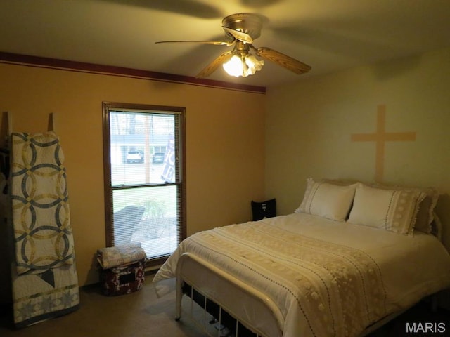 bedroom with multiple windows, carpet floors, and a ceiling fan