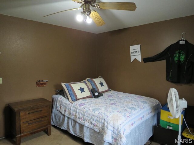 carpeted bedroom featuring a ceiling fan