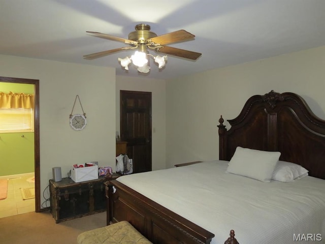 carpeted bedroom featuring connected bathroom and ceiling fan