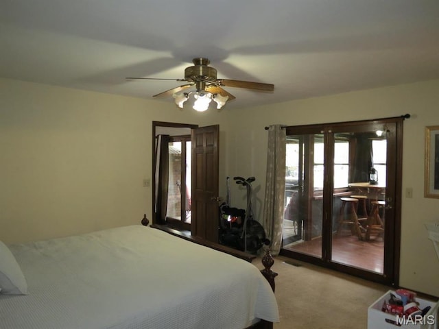carpeted bedroom with access to exterior and ceiling fan