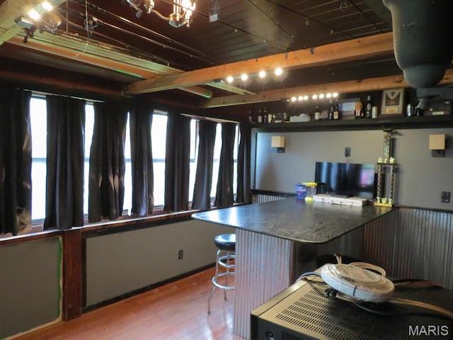 kitchen featuring wood finished floors and a chandelier