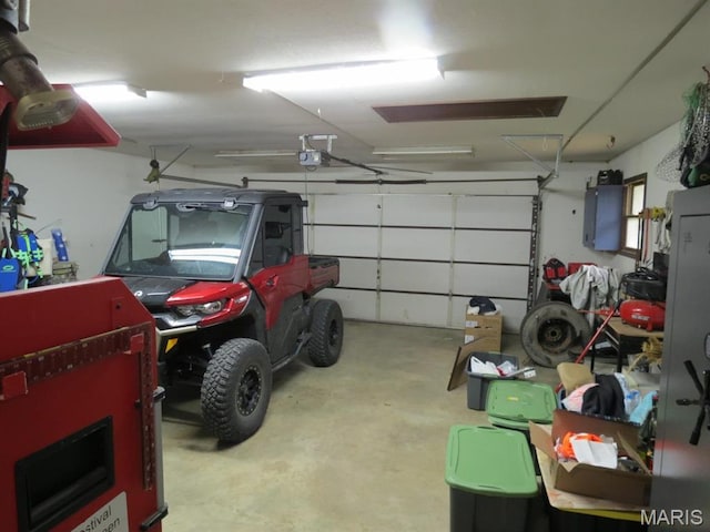 garage featuring a garage door opener and electric panel