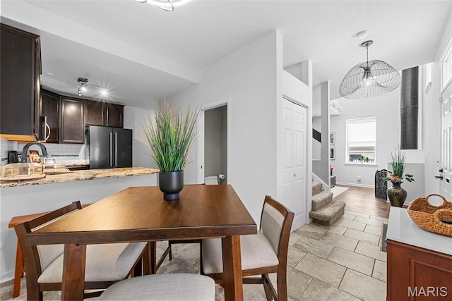 4366 W Pine Blvd Unit Cw, Saint Louis, MO 63108 - dining area featuring stairs and baseboards