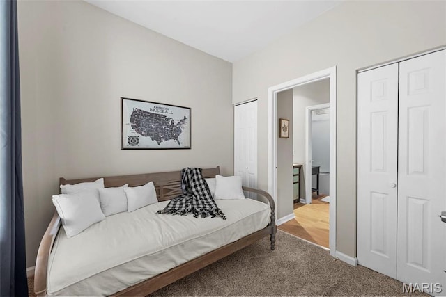 4366 W Pine Blvd Unit Cw, Saint Louis, MO 63108 - carpeted bedroom featuring multiple closets and baseboards