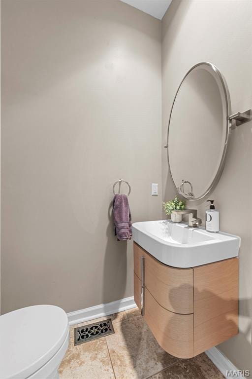4366 W Pine Blvd Unit Cw, Saint Louis, MO 63108 - bathroom with baseboards, vanity, toilet, and tile patterned flooring