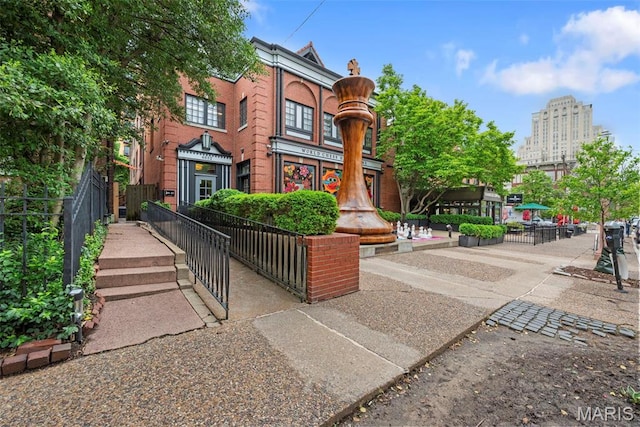 4366 W Pine Blvd Unit Cw, Saint Louis, MO 63108 - view of front of home featuring fence and brick siding