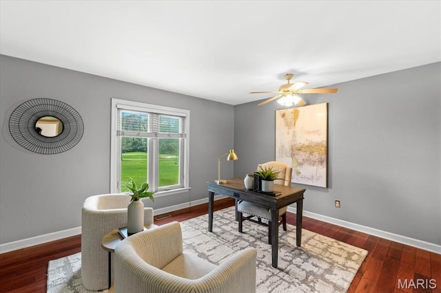 office area featuring baseboards, ceiling fan, and wood finished floors