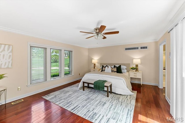 bedroom featuring wood-type flooring, crown molding, baseboards, and a ceiling fan