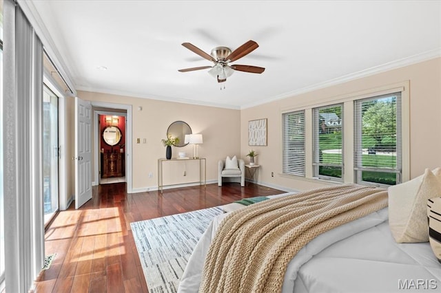 bedroom with ornamental molding, wood finished floors, baseboards, and a ceiling fan