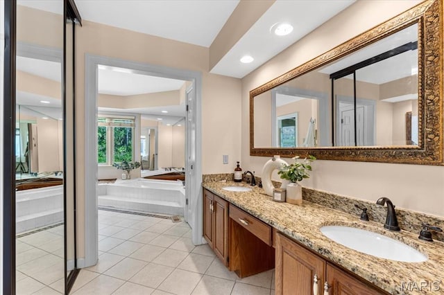 bathroom with double vanity and tile patterned flooring