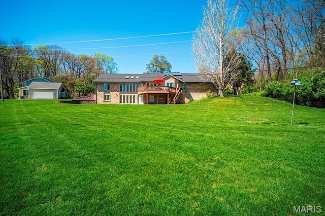 rear view of property with a wooden deck, a yard, and stairs